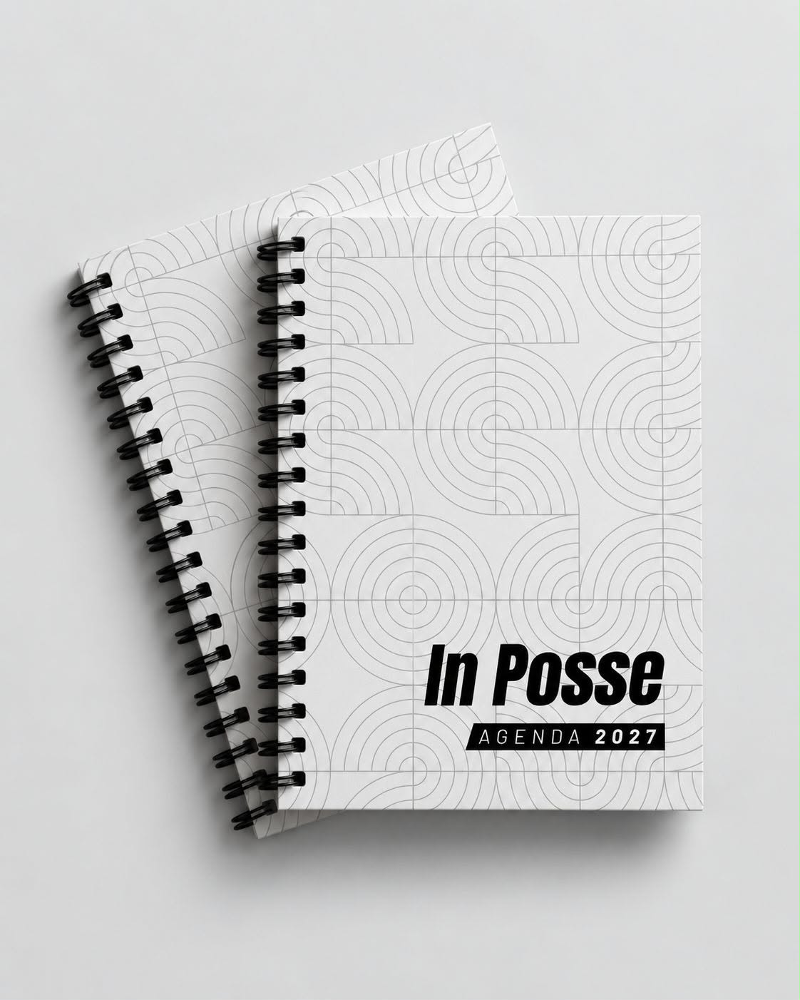 Dos agendas In Posse 2027 con portada blanca y patrón de arcos
